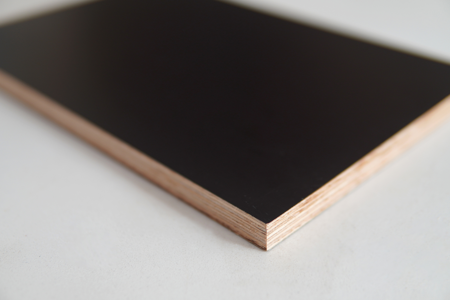 PRO Form precision formwork plywood panels showing dark phenolic surface and rubberwood veneer layers